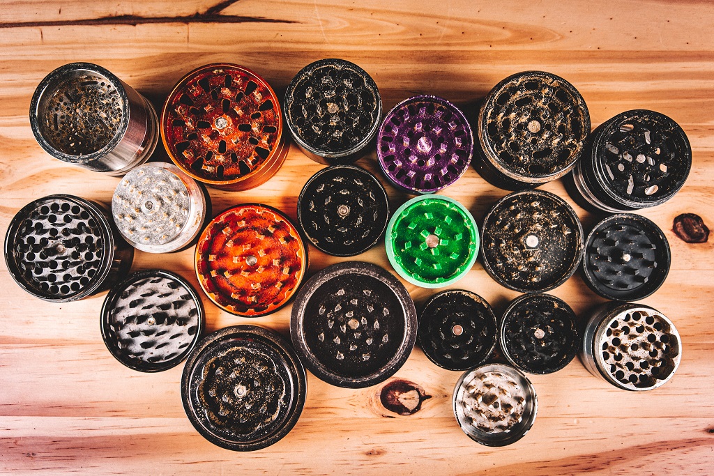 A group of different colored pots sitting on top of a wooden table