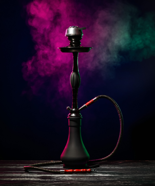 A hookah smoking device with colored smoke coming out of it